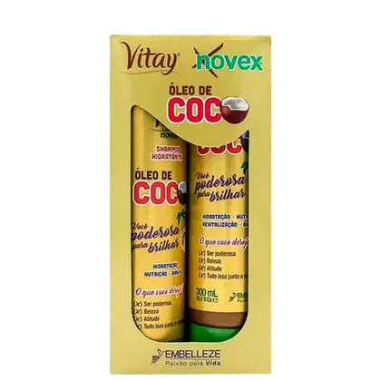 A imagem mostra caixa com kit de shampoo e condicionador Embelleze Novex Óleo de Coco, de 300ml. A embalagem traz tons de marrom e dourado e ilustrações de coco. Destaca benefícios como hidratação, nutrição, revitalização e brilho.