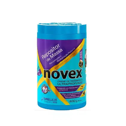 A imagem mostra o Creme de Tratamento Repositor de Massa 400g da marca Novex. Possui embalagem redonda na cor azul turquesa e roxa. Destaca que é um tratamento para recuperação e revitalização profunda para cabelos quimicamente tratados.