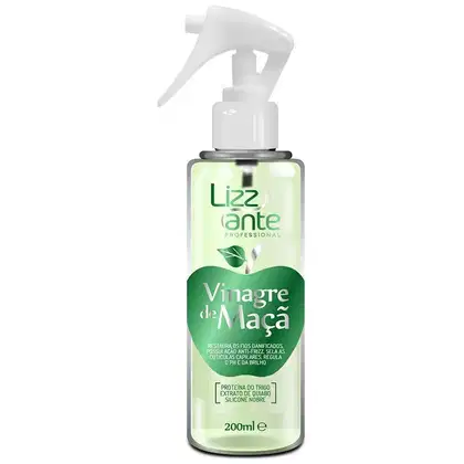 Finalizador capilar. A embalagem é um frasco plástico branco com um borrifador, e o rótulo exibe o nome do produto "Vinagre de Maçã" em letras verdes. O frasco também contém informações sobre os ingredientes, como proteína de trigo e extrato de quiabo.