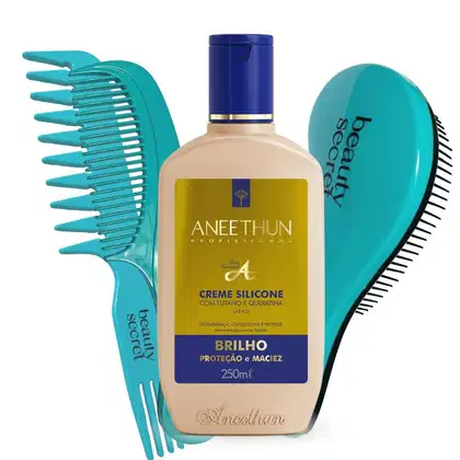 Conjunto de produtos de beleza da marca Aneethun. No centro o creme e ao redor uma escova e dois pentes.