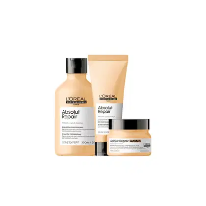 A imagem mostra um kit com três produtos da linha Absolut Repair da L'Oréal Professionnel. Um frasco de shampoo de 300ml, uma embalagem tubular de condicionador e um pote redondo. Todos com cor bege e tampa preta.