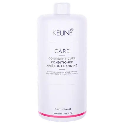 Frasco branco da linha Keune Care, contendo Condicionador Confident Curl, com rótulo destacando o tipo de cabelo (2A-4C) e o volume de 1000 ml.