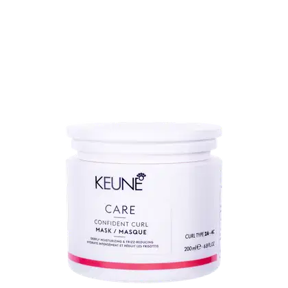 O produto apresentado é um pote branco da marca Keune, contendo uma máscara para cabelos encaracolados chamada "Confident Curl Mask". O pote possui uma tampa branca e contém 200 ml do produto.