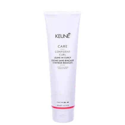 Tubo branco de 300 ml do produto Keune Care Confident Curl, um creme para cachos sem enxágue que hidrata e define os fios. O rótulo destaca o nome do produto e a indicação de tipo de cachos 3A-4A.