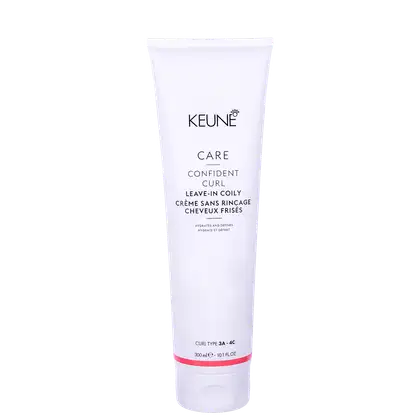 O produto apresentado é um creme leave-in da linha Confident Curl da marca Keune. A embalagem é um tubo branco com o logotipo da marca e o nome do produto "Confident Curl Leave-in Coily Creme".