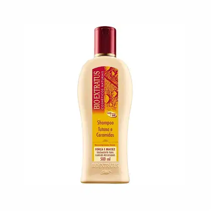 Frasco de shampoo da marca Bio Extratus, com 500 ml de capacidade, em embalagem com predominância de cores amarela e vermelha, contendo informações sobre os ingredientes "tutano e ceramidas" no rótulo.