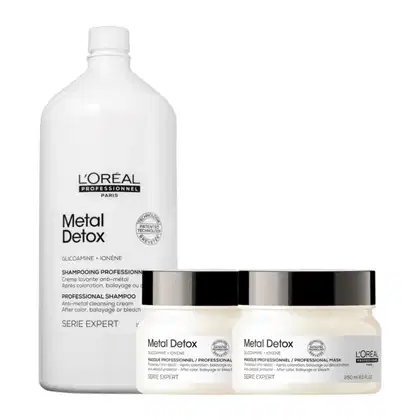 A imagem mostra um kit com três produtos da marca L'Oréal Professionnel. Um frasco grande e branco de 1,5L de shampoo e dois potes redondos de máscara, brancos com tampas pretas.