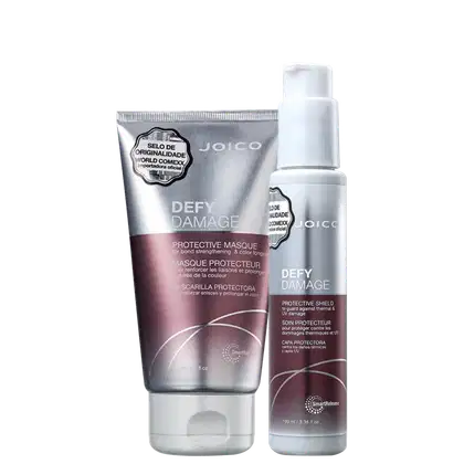A imagem mostra dois produtos da linha Defy Damage da marca Joico: máscara capilar "Defy Damage Protective Masque" de 150ml em uma embalagem prateada com detalhes em roxo; e leave-in "Defy Damage Protective Shield" em um frasco prata com detalhes em roxo.
