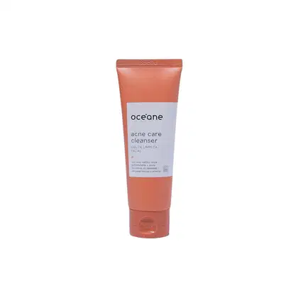 A imagem mostra a embalagem do gel de limpeza facial Océane Acne Care Cleanser. O produto vem em um tubo plástico na cor terracota com um rótulo branco e letras pretas descrevendo nome e marca.