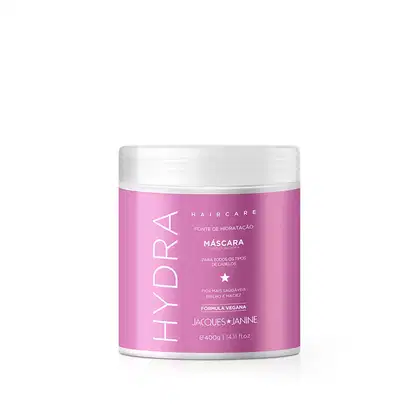 Máscara condicionadora da linha Haircare da Jacques Janine Professionnel, em embalagem plástica branca e rosa, com rótulo indicando ser uma fonte de hidratação para todos os tipos de cabelos.
