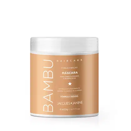 Máscara para cabelos frágeis e quebradiços da linha Haircare da Jacques Janine Professionnel, em embalagem branca e laranja, com fórmula vegana que estimula o crescimento e diminui a chance de quebra.