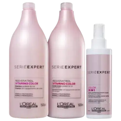 A imagem apresenta três produtos da L’Oréal Professionnel: dois frascos (500ml) rosa claro, e um spray branco e rosa, para cabelos coloridos.