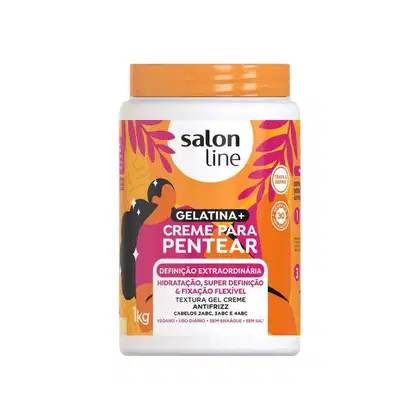O produto apresentado é um creme para pentear da marca Salon Line. A embalagem é um pote branco com tampa laranja, contendo 1 kg do produto.