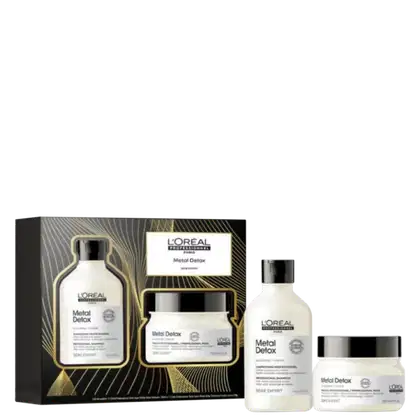 A imagem mostra um kit L'Oréal Professionnel, dentro de uma caixa personalizada e, do lado direito, um frasco arredondado de shampoo e um pote redondo de máscara capilar, ambos de cor branca, com rótulo branco e tampa preta.