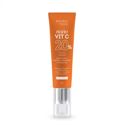 Tubo laranja com rótulo da marca Extratos da Terra, contendo o produto "Nano Vit C 20%" para uso facial. O rótulo destaca os benefícios do produto, como reduzir rugas e uniformizar a pele, com 20% de vitamina C nano.