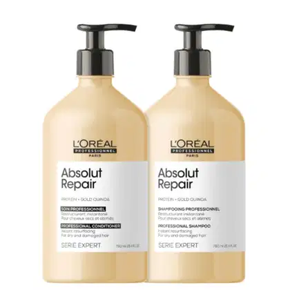 Shampoo e condicionador da linha Absolut Repair da L'Oréal Professionnel, com embalagens de plástico bege e detalhes em preto, contendo informações sobre os ingredientes e benefícios do produto.