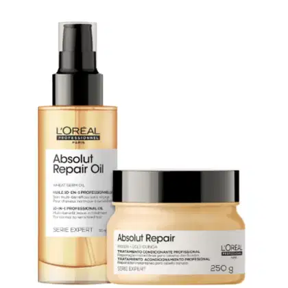 A imagem mostra dois produtos da linha Absolut Repair da L’Oréal Professionnel. Um óleo capilar em spray num frasco dourado e máscara capilar num pote dourado, com tampa preta.