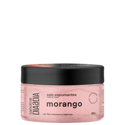 Pote preto com rótulo rosa contendo sais espumantes de morango para rosto e corpo, da marca Labotrat. Produto com textura e aparência suave, indicado para pele uniforme e com maior viço.