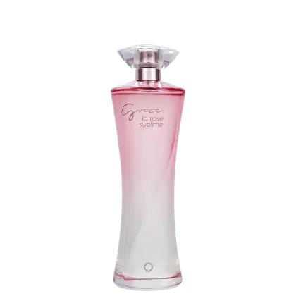 Frasco de perfume rosa com rótulo "Grace la rose sublime" em letras douradas. Embalagem de vidro com tampa transparente e detalhes em metal rosé.