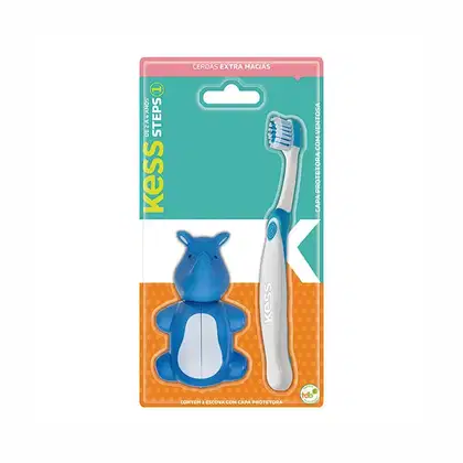 Escova de dentes infantil Kess com capa protetora em embalagem de plástico rosa e azul. O produto apresenta uma escova de dentes branca e um acessório em formato de hipopótamo azul.