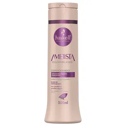 Condicionador da linha Ametista da marca Haskell. O rótulo exibe o nome da linha "Ametista" e a descrição "Desamareladora". Também são destacados alguns ingredientes e características, como a ausência de parabenos e a certificação vegana.