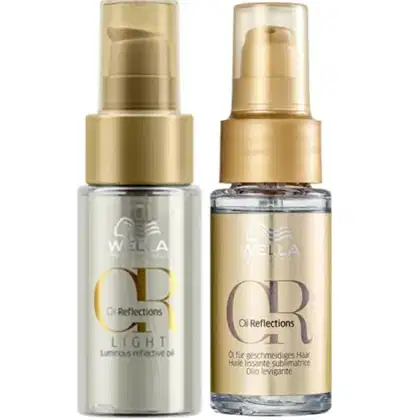 Dois frascos de produtos Wella Professionals da linha Oil Reflections, um frasco de óleo capilar leve e outro de óleo levigante, ambos com embalagens douradas e brancas.