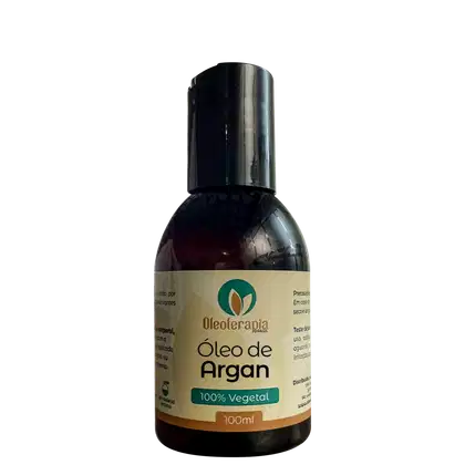 O produto apresentado é um frasco de Óleo de Argan da marca Oleoterapia Brasil. O rótulo indica que o produto é 100% vegetal e possui 100ml de volume.