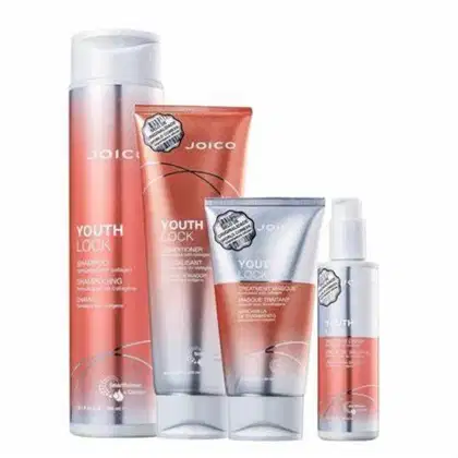 A imagem mostra uma linha de produtos para cabelos da marca Joico chamada "Youth Lock". Inclui um shampoo, um condicionador, uma máscara e um leave-in. As embalagens apresentam tom de laranja com prata.
