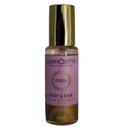 Apresenta pequeno frasco de perfume para corpo e cabelos da marca Luminositta Professional. O frasco é rosa, com detalhes em dourado.