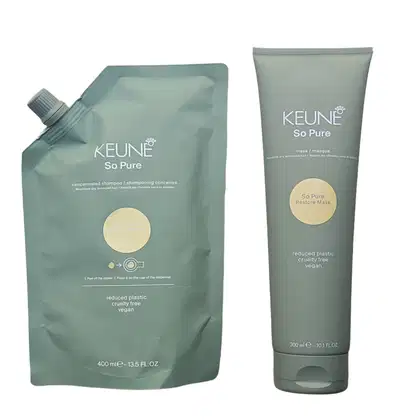 A imagem mostra dois produtos de cuidados capilares da marca Keune, da linha So Pure. Um é um shampoo concentrado que vem em uma embalagem flexível de 400ml. O outro é uma máscara capilar que vem em um tubo verde de 300ml.