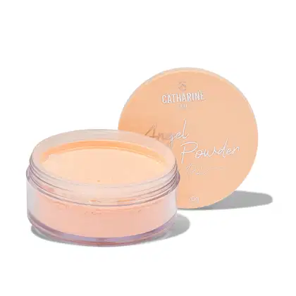 Pó facial compacto da marca Catharine Hill, em embalagem circular de cor pêssego com rótulo destacando o nome "Angel Powder". O produto possui textura leve e aspecto suave, ideal para aplicação na pele.