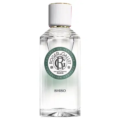 Frasco de vidro transparente com tampa branca e dourada, contendo o produto de beleza "Shiso" da marca Roger & Gallet. O rótulo verde e branco apresenta o logotipo e nome da marca em destaque.