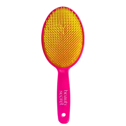 Escova de cabelo Beauty Secret. Corpo oval em plástico rígido rosa com o nome da marca gravado. Cerdas densas e arredondadas em tons vibrantes de amarelo e laranja, formando um padrão de pontos. Design ergonômico para facilitar o manuseio.