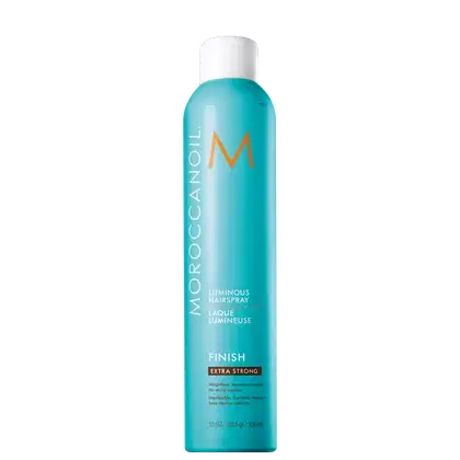 Frasco de spray de cabelo Moroccanoil Luminous, com embalagem branca e azul turquesa, rótulo com a marca Moroccanoil e a indicação "Finish Extra Strong" para finalização extra forte.