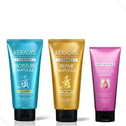 Três frascos de tratamentos capilares da marca Kerasys: Moisture Ampoule em azul, Repair Ampoule em dourado e Ceramide Ampoule em rosa, com rótulos indicando os benefícios avançados de cada produto.