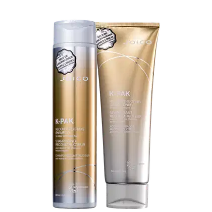 A imagem mostra um shampoo em embalagem cilíndrica prateada com detalhes dourados e um condicionador reconstrutor em embalagem dourada tipo sachê. Ambos apresentam o logotipo Joico.