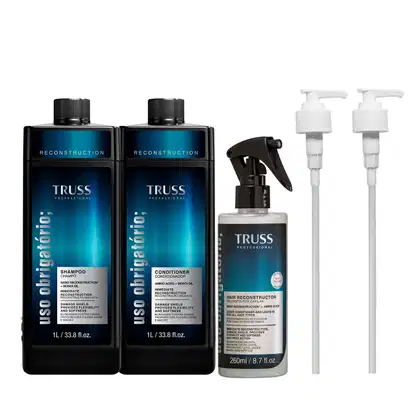 A imagem mostra 3 produtos da linha Uso Obrigatório: shampoo e condicionador de 1L e fluido de tratamento em spray de 260ml. Todos possuem embalagem preta com detalhes em azul escuro no rótulo. Ao lado, duas válvulas pump que acompanham o kit.
