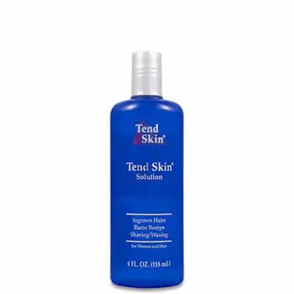 Tend Skin Solution é um produto líquido em uma embalagem plástica azul. A embalagem é um frasco cilíndrico com tampa prata. O rótulo na frente exibe o nome do produto "Tend Skin Solution" em letras brancas, bem como o logotipo da marca Tend Skin.
