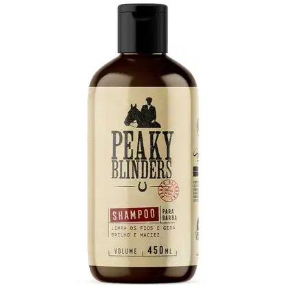 Frasco de shampoo da marca Peaky Blinders, com rótulo bege e preto, contendo 450 ml do produto. O rótulo apresenta o nome da marca em destaque e informações sobre o uso do shampoo para barba.