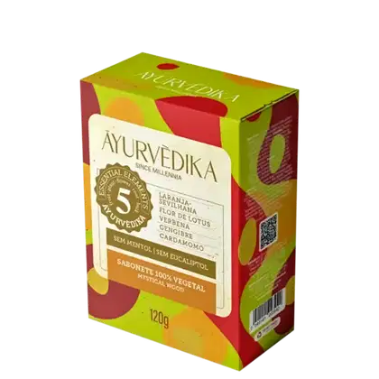 Sabonete 100% vegetal Ayurvedika. A embalagem é uma caixa retangular de cor verde e vermelha, com detalhes em amarelo.