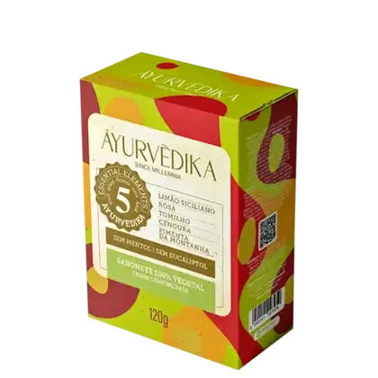 Sabonete vegetal da marca Ayurvedika, com 120g de peso. O rótulo destaca que o produto é livre de mentol e eucaliptol, e menciona alguns dos ingredientes como limão siciliano, rosa, tomilho, cenoura e menta da montanha.