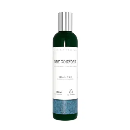 Frasco de shampoo Dry Confort da marca Grandha, com 300ml de capacidade. Embalagem em verde escuro e branco, com rótulo destacando o nome do produto e informações sobre sua composição.