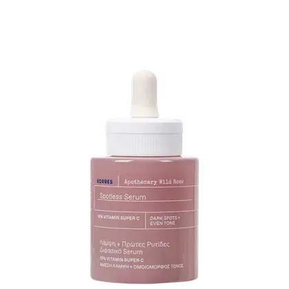 Frasco de soro facial da marca Korres, com rótulo em inglês e grego, contendo 15% de vitamina C, indicado para manchas escuras e uniformidade do tom da pele. Embalagem de vidro com conta-gotas branco.
