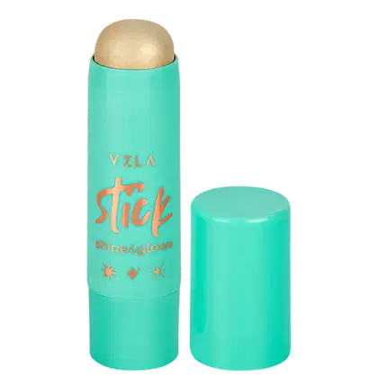 Bastão iluminador compacto da marca Vizzela Cosméticos, com embalagem em tom de verde menta e detalhes em laranja. O produto é descrito como "Shine & Glow" no rótulo.