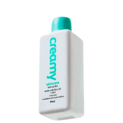 A imagem mostra um frasco de tônico antiacne retangular branco com tampa verde.