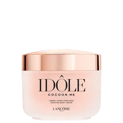 Creme corporal perfumado da linha Idole da Lancôme, em embalagem rosa e dourada com o nome da marca e do produto destacados. O frasco possui formato arredondado e tampa metálica.