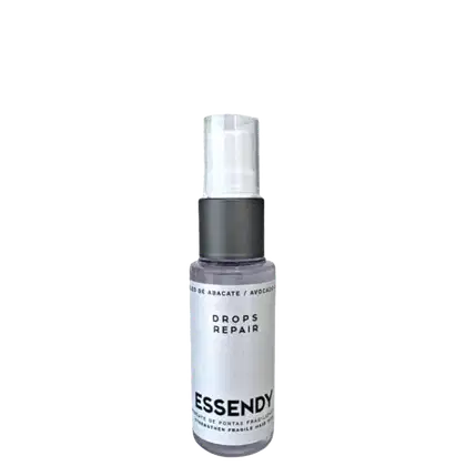 Óleo capilar. O rótulo do produto exibe o nome "Drops Repair" em letras brancas sobre um fundo branco. Não é possível identificar qualquer pessoa na imagem, apenas o produto em si.