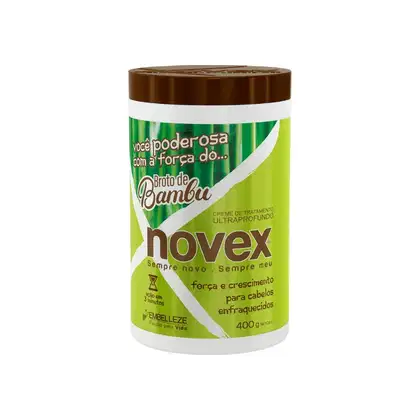 A imagem mostra o creme de tratamento "Broto de Bambu" 400g da marca Novex. Traz a informação de força e crescimento para cabelos enfraquecidos. O pote é cilíndrico, na cor verde e branca.