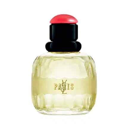 Frasco de perfume Yves Saint Laurent Paris com tampa vermelha redonda e corpo preto, contendo um líquido amarelado. O rótulo em dourado destaca o nome da marca e da cidade de Paris.