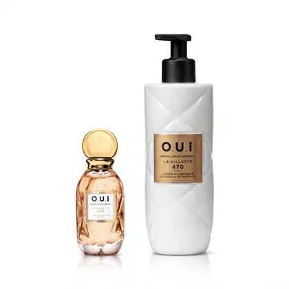 Dois produtos de beleza da marca O.U.i: um frasco de perfume com tampa dourada e um frasco branco com bomba preta, contendo uma loção hidratante. Ambos os produtos exibem o nome da marca e o número 470 em seus rótulos.